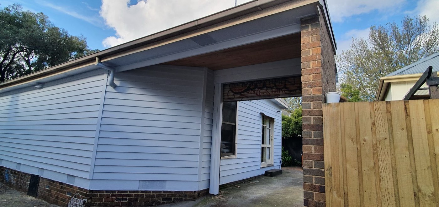 The carport and weatherboards after painting