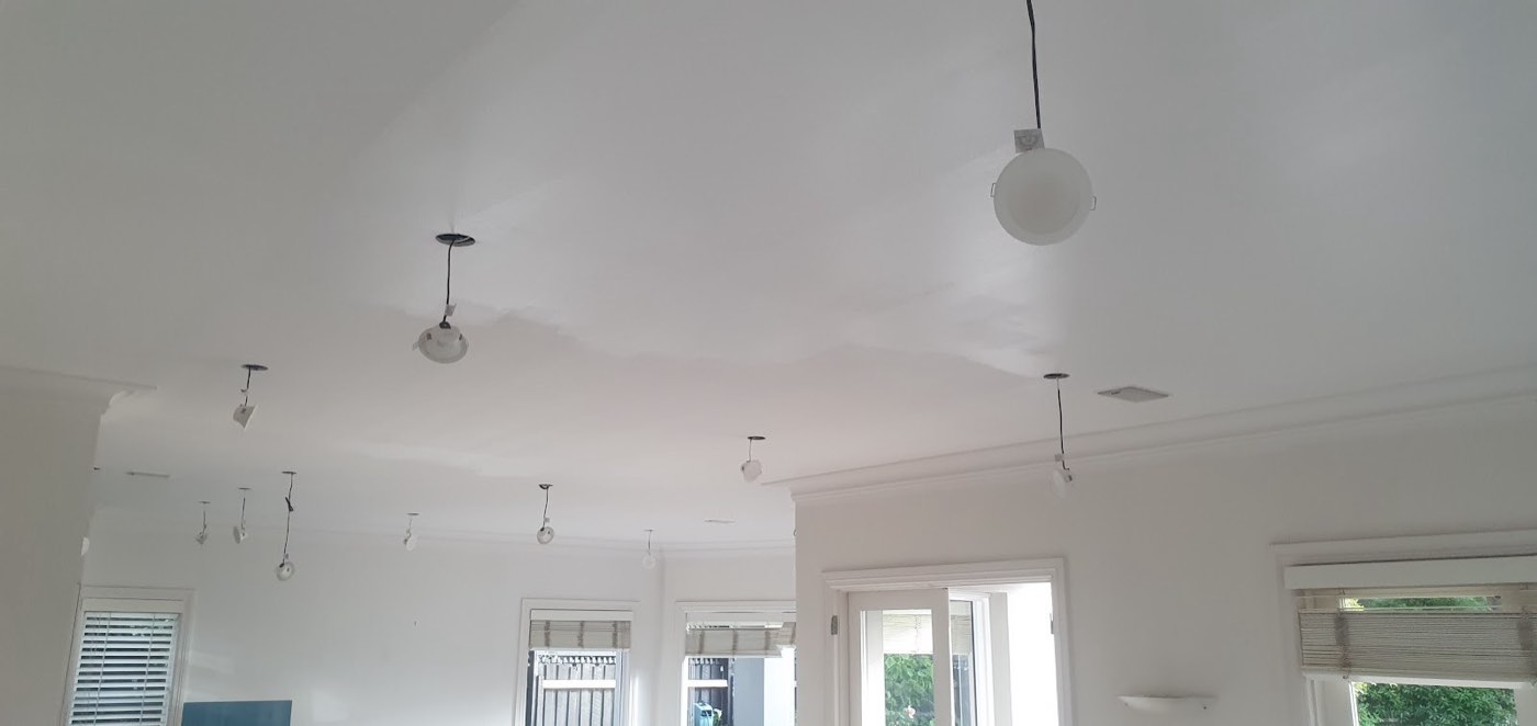 A freshly painted white ceiling in an open-plan room