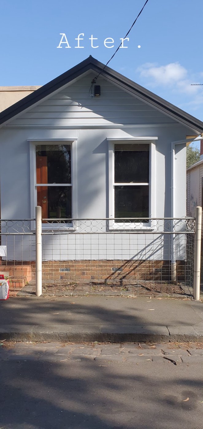 The front of a weatherboard cottage after repainting