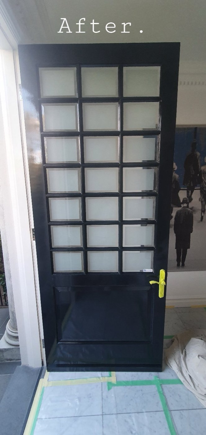 A glazed front door finished in gloss black